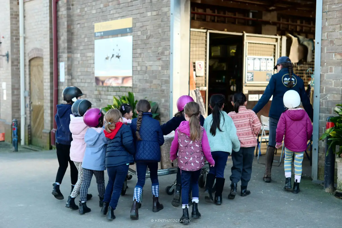 Happy children at Eastside Riding Academy school holiday horse riding program Centennial Park